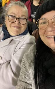 Our lovely Participant, Maria, supported by Amanda, attending an NRL game to cheer on her team.